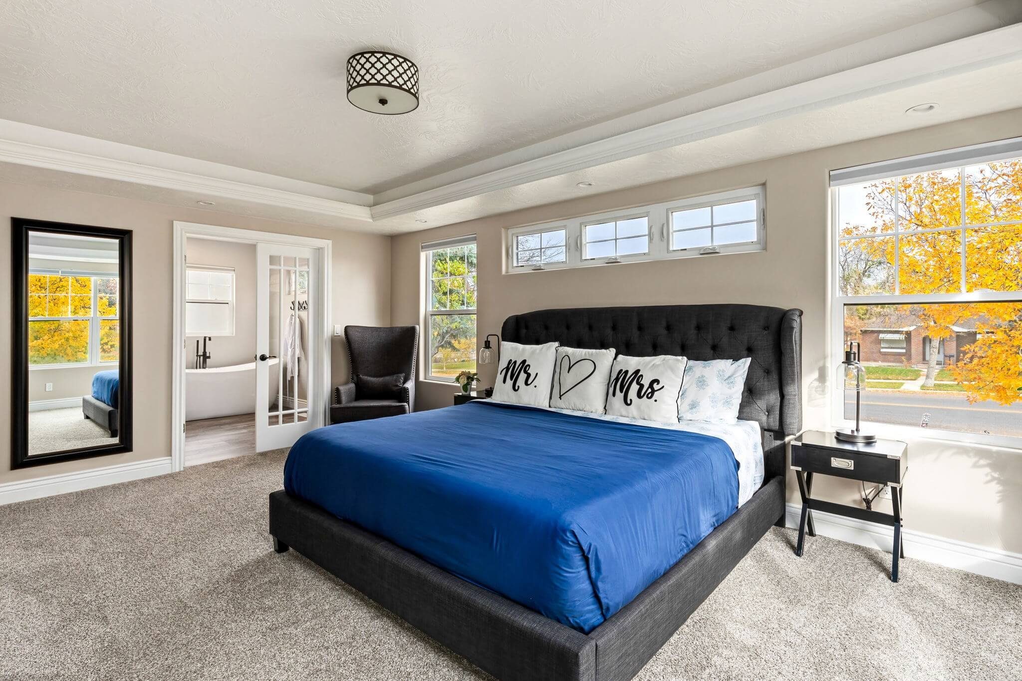 Primary bedroom in a professionally staged luxury home in Great Falls Montana, designed to feel calm, spacious, and inviting to buyers.