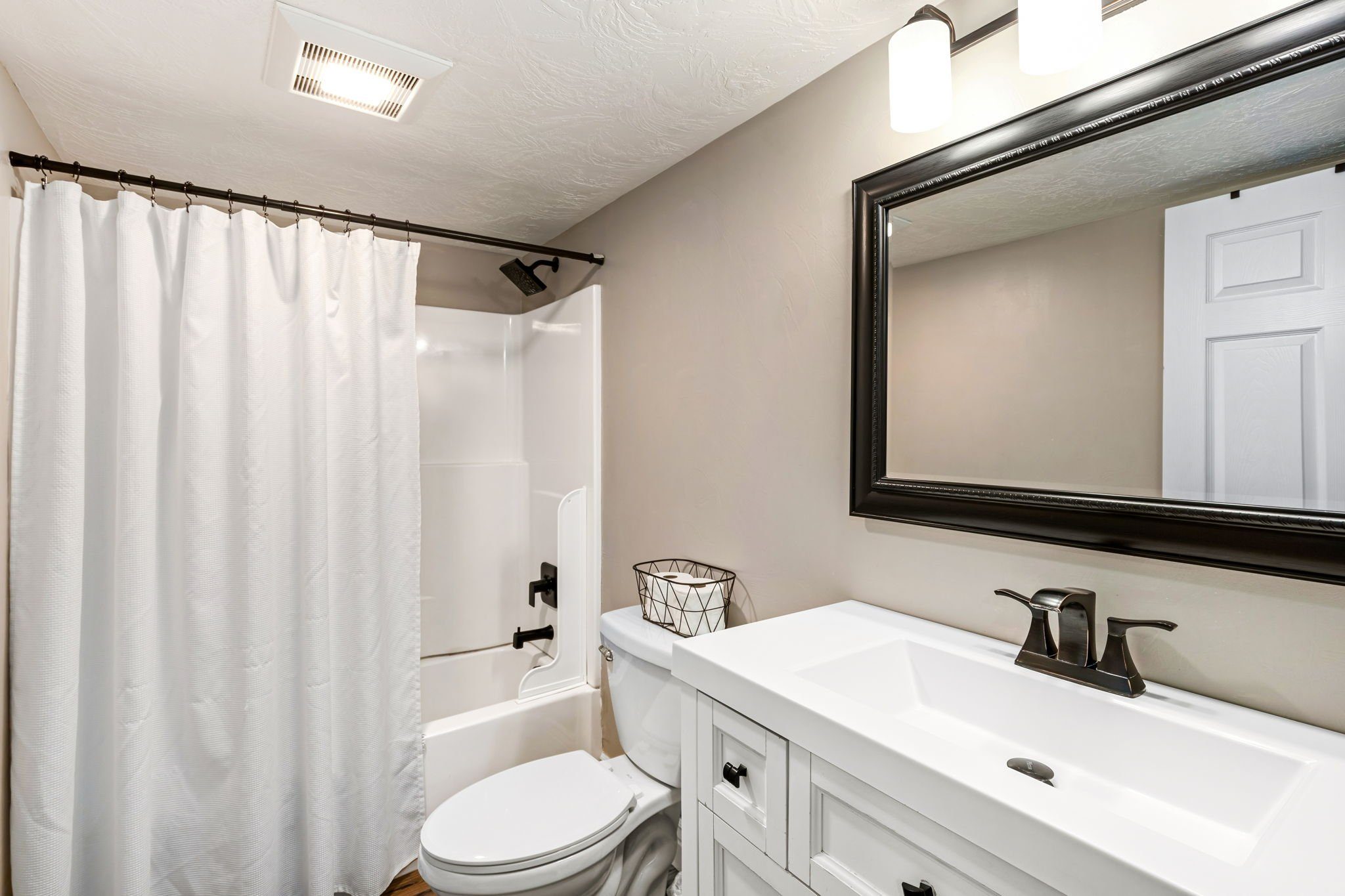 Wrecked-Refined-Luxe-Basement-Guest-Bath-Tub-Shower-Combo-Clean-Design-Great-Falls-MT-75.jpg.jpg